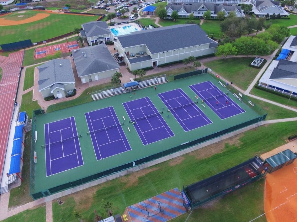 aerial image of outdoor tennis courts after resurfacing project completion