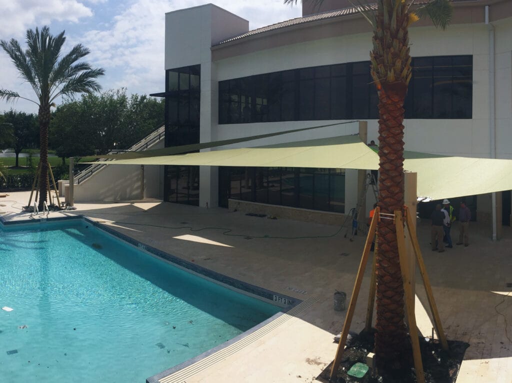 image of shade structure installation above pool deck