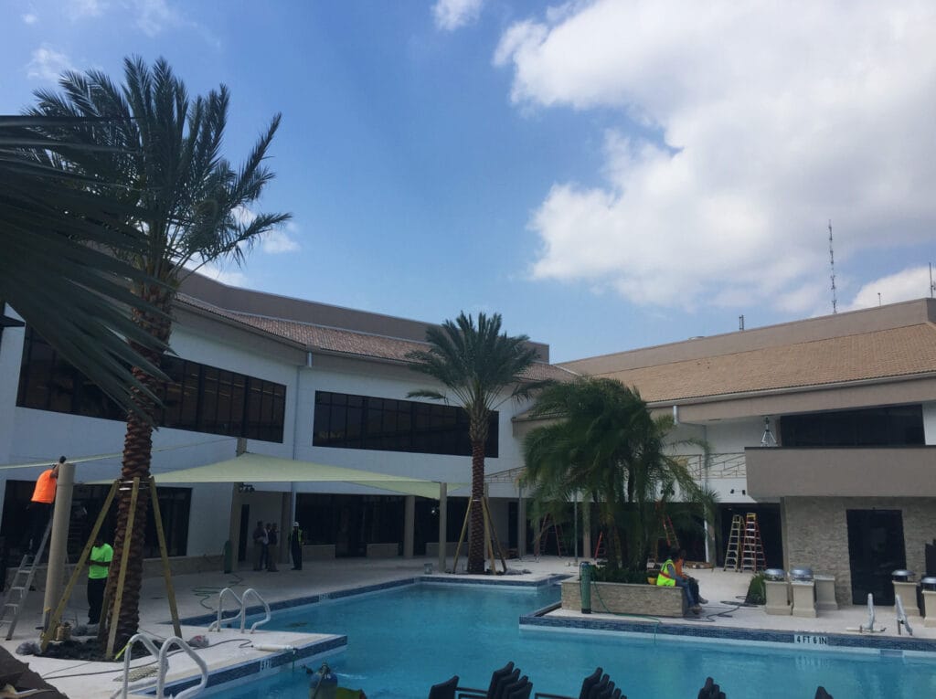 image of shade structure installation above pool deck