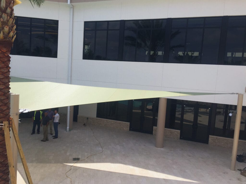 image of shade structure installation in front of a building