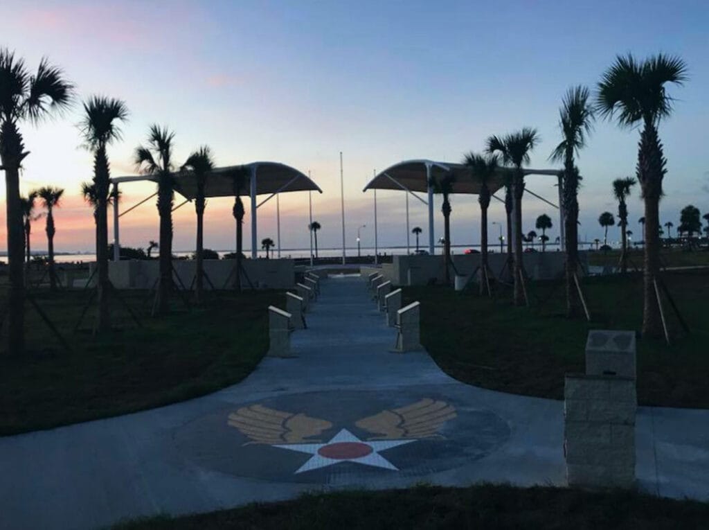 image of shade structure over memorial park at macdill airforce base at sunset