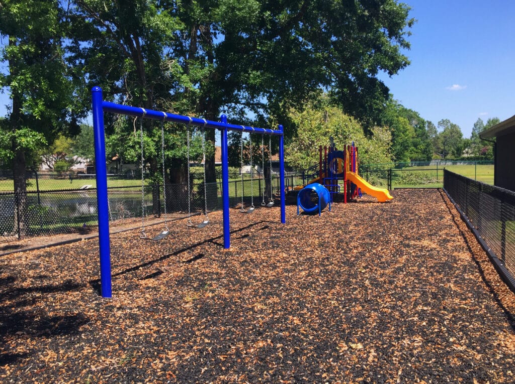 image of playground installation within gate enclosure