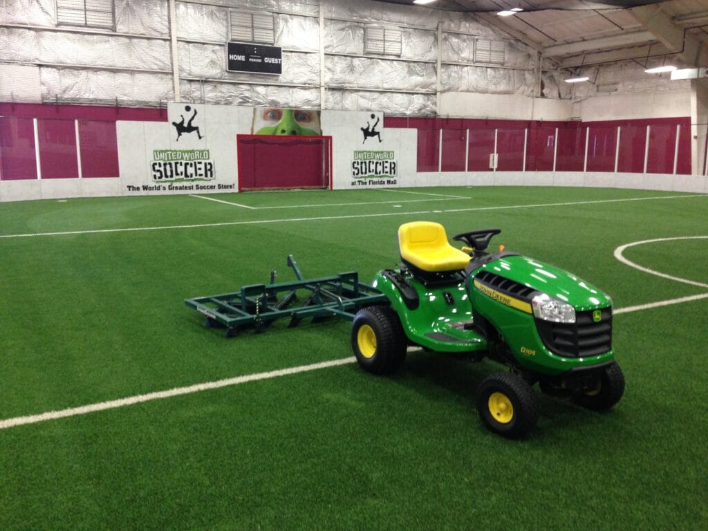 driverless tractor on top of indoor synthetic soccer field