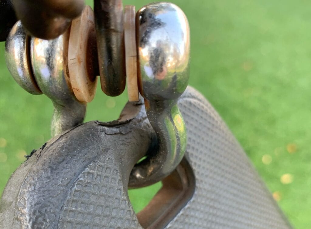 image of closeup metal ball joint connecting playground equipment