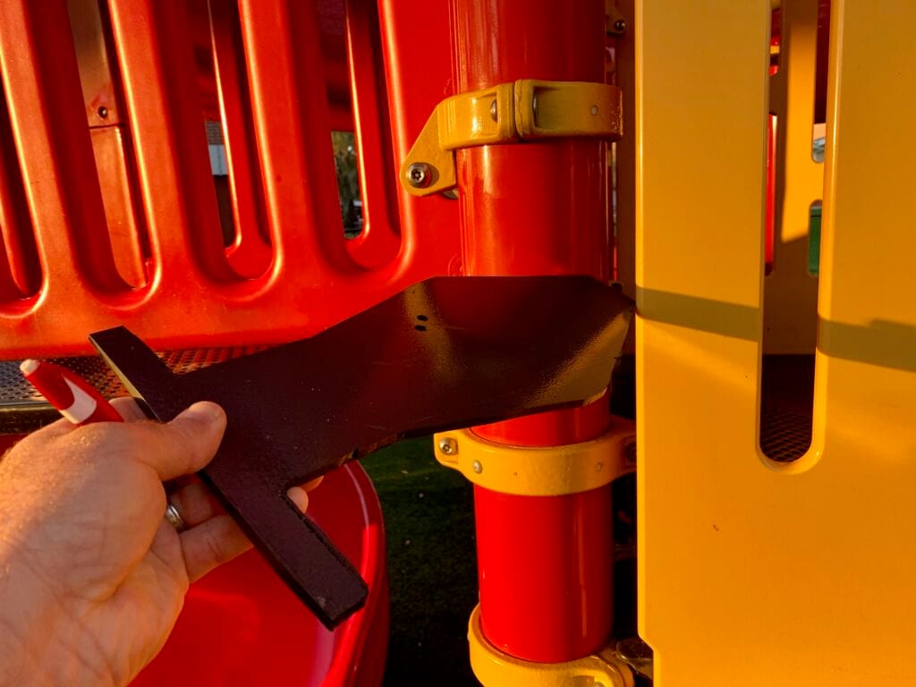 image of measuring on a playground during safety inspection