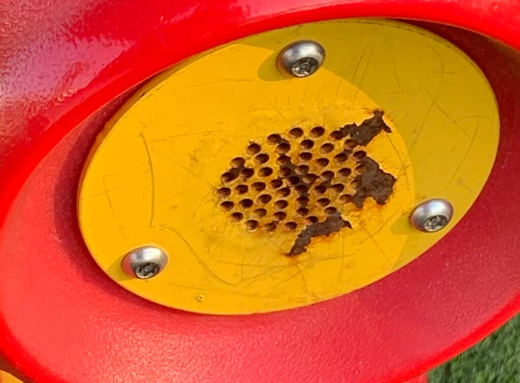 image of broken playground plastic speaker